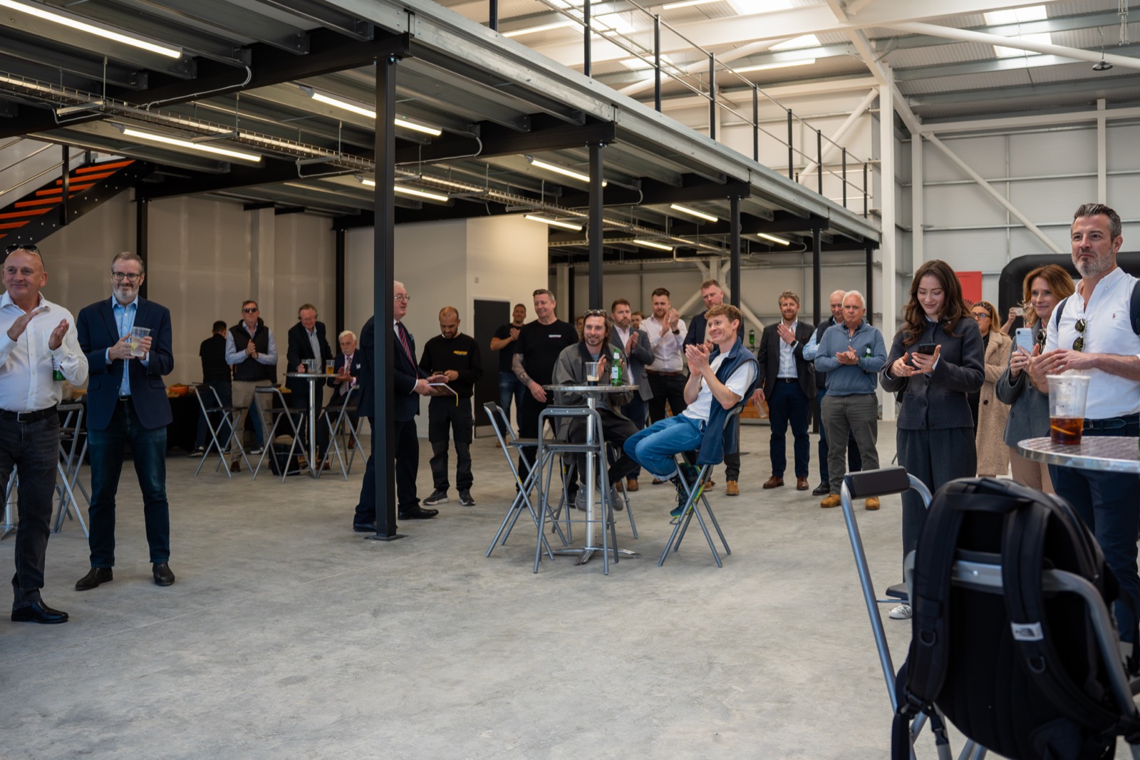 Guests applaud during the Engine Works Park launch